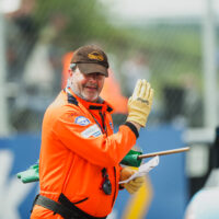 Marshal at Thruxton waving