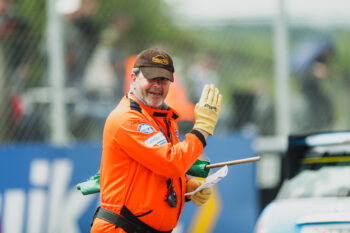 Marshal at Thruxton waving